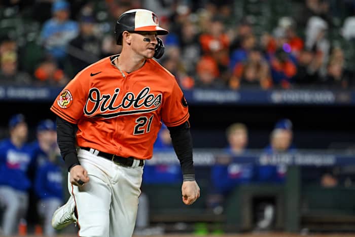 Oct 8, 2023; Baltimore, Maryland, USA; Baltimore Orioles left fielder Austin Hays (21) hits a single during the ninth inning against the Texas Rangers during game two of the ALDS for the 2023 MLB playoffs at Oriole Park at Camden Yards. Mandatory Credit: Tommy Gilligan-USA TODAY Sports